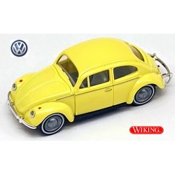 VW Cox 1200 jaune avec pneus à flanc blanc